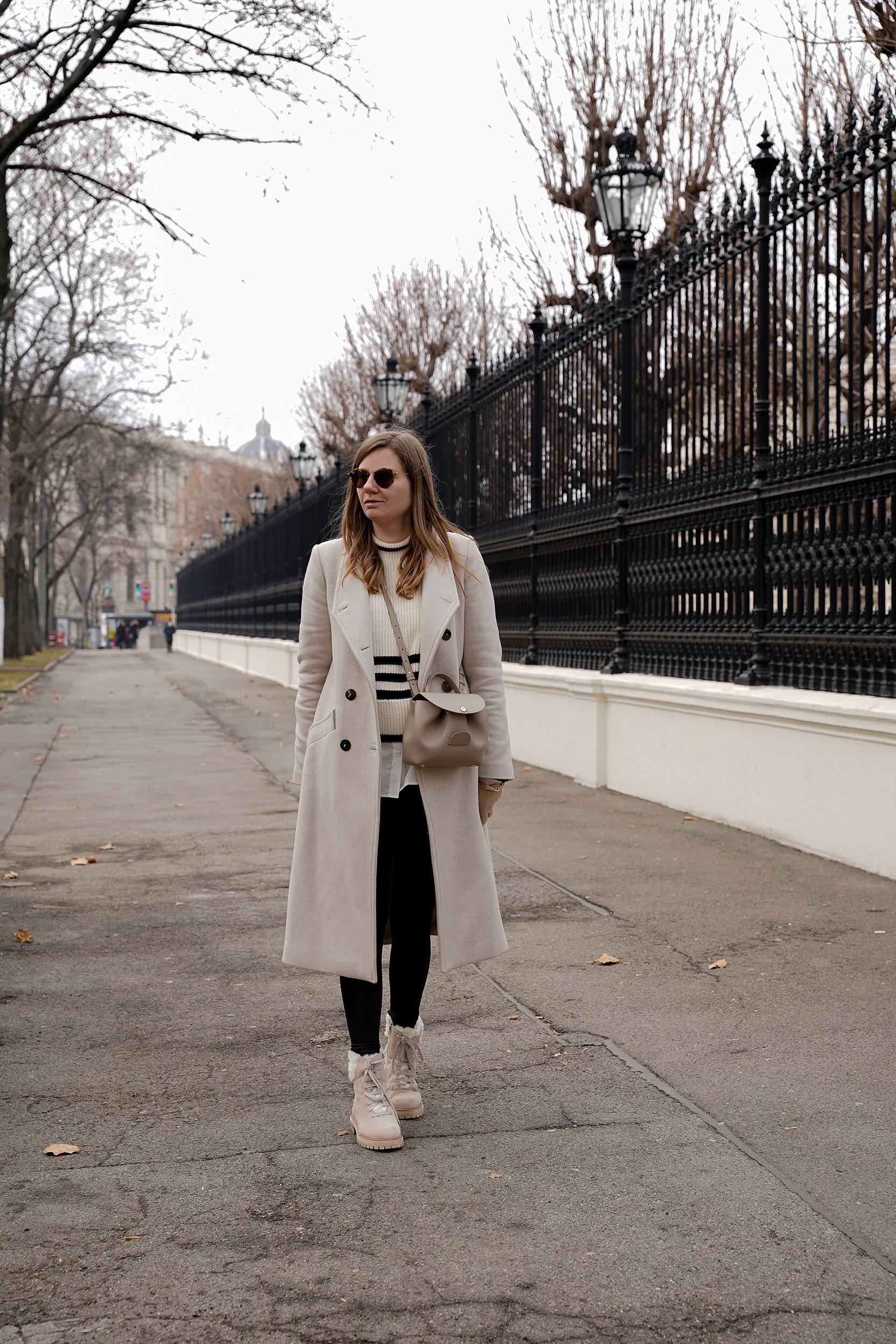 Winter Outfit Vienna Streetstyle, Sweater, winter coat, striped sweater, boots, polene bag