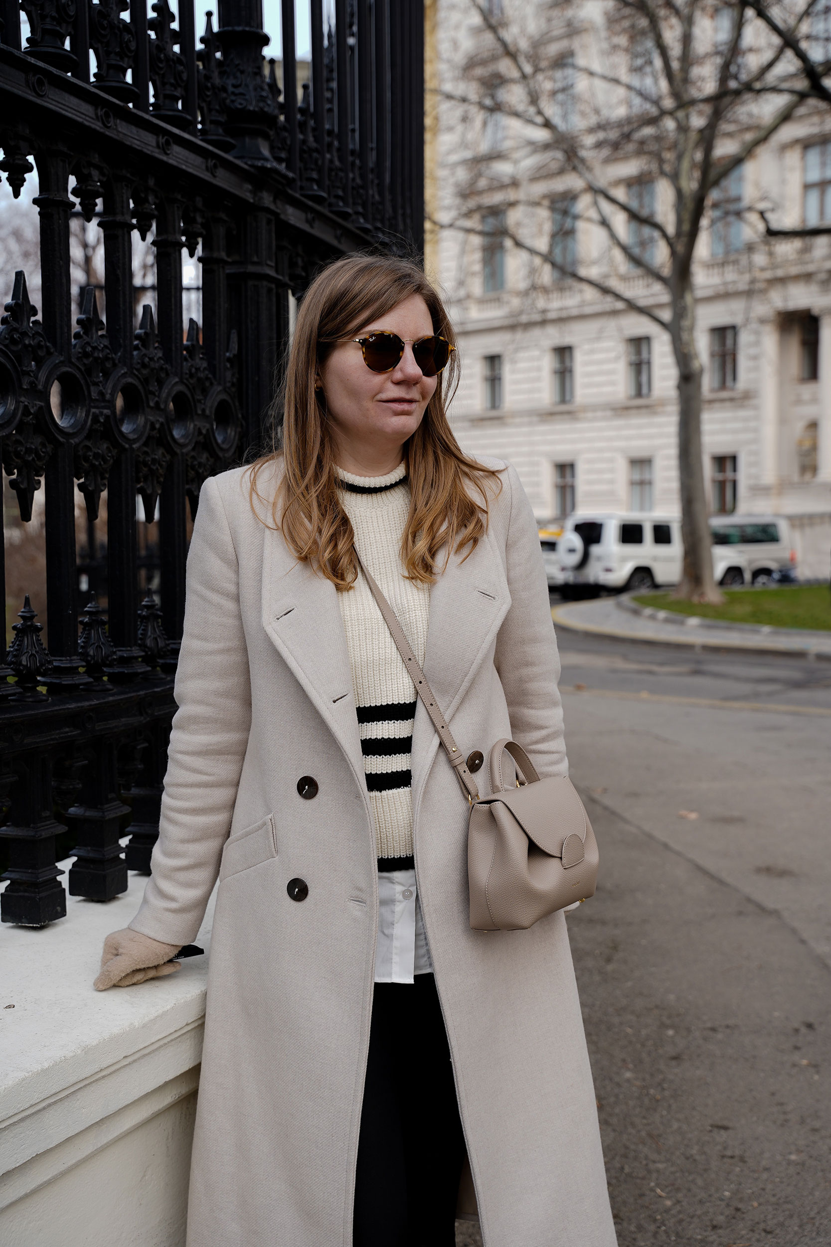 Winter Outfit Vienna Streetstyle, Sweater, winter coat, striped sweater, boots, polene bag