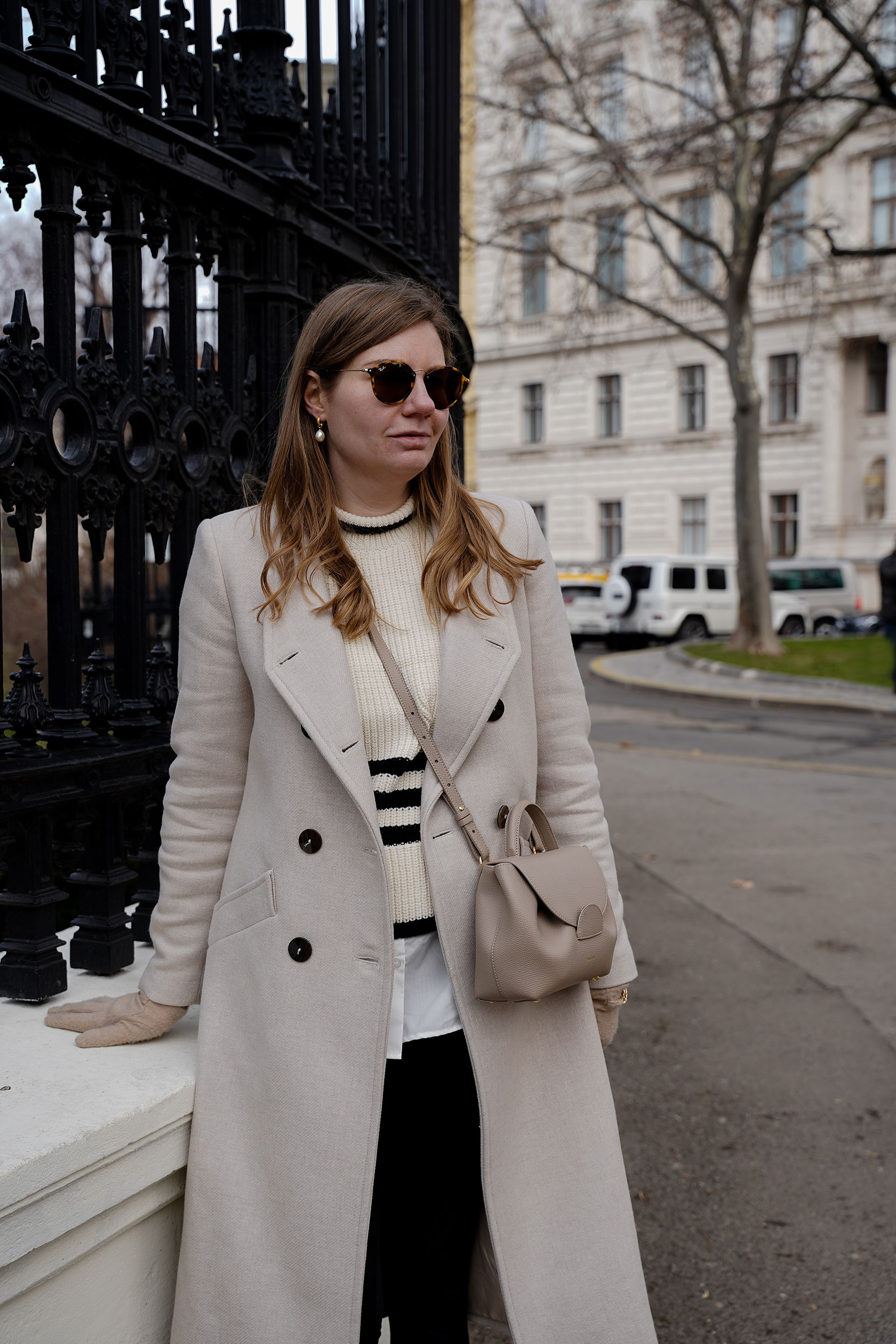 Winter Outfit Vienna Streetstyle, Sweater, winter coat, striped sweater, boots, polene bag