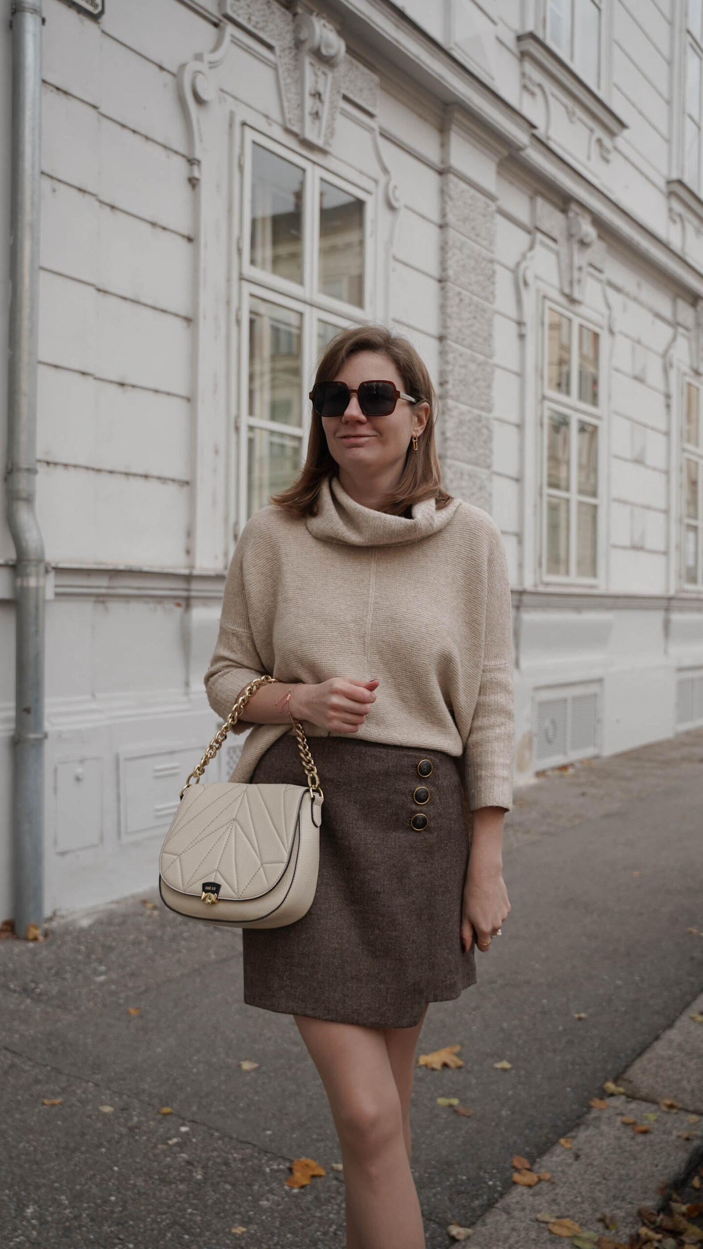 Sezane skirt, beige sweater, Zoe Lu best buddy Creme bag