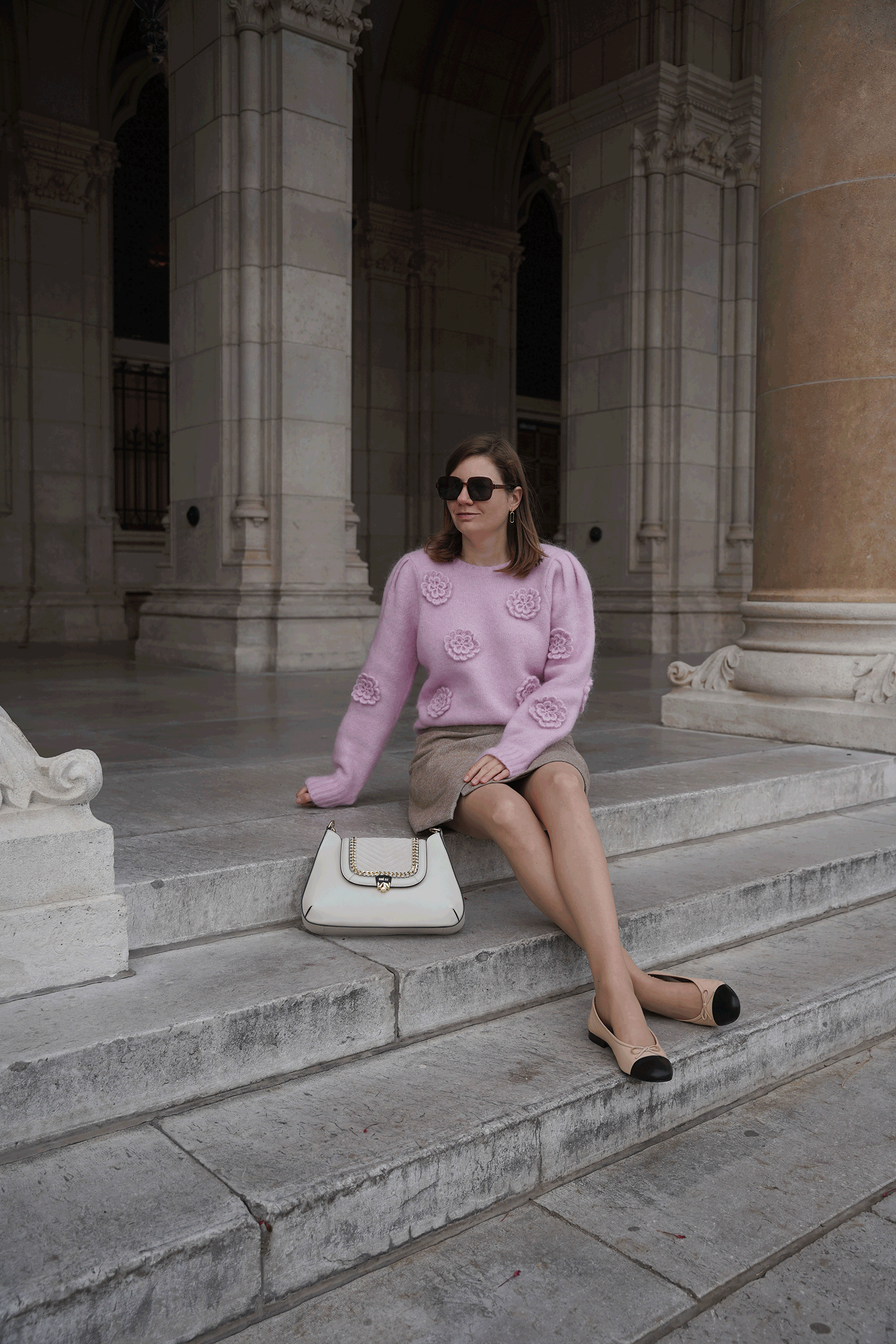 pink sweater, beige mini skirt