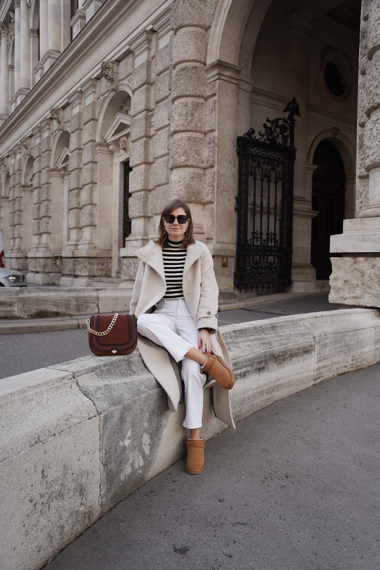 Winter outfit Vienna mango coat Ugg boots striped sweater white jeans 